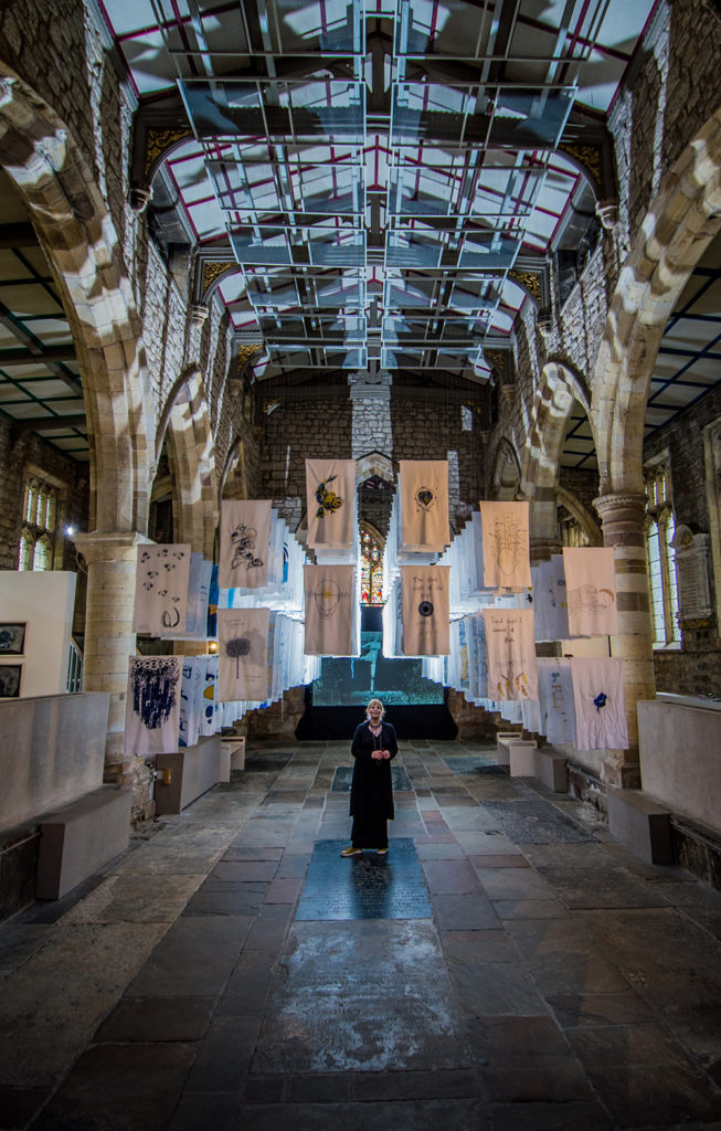 1001 Nights, installation of embroidered pillowcases, Susan Aldworth. Shown in The Dark Self, York St Mary’s, 2017. Photograph by James Hardisty.