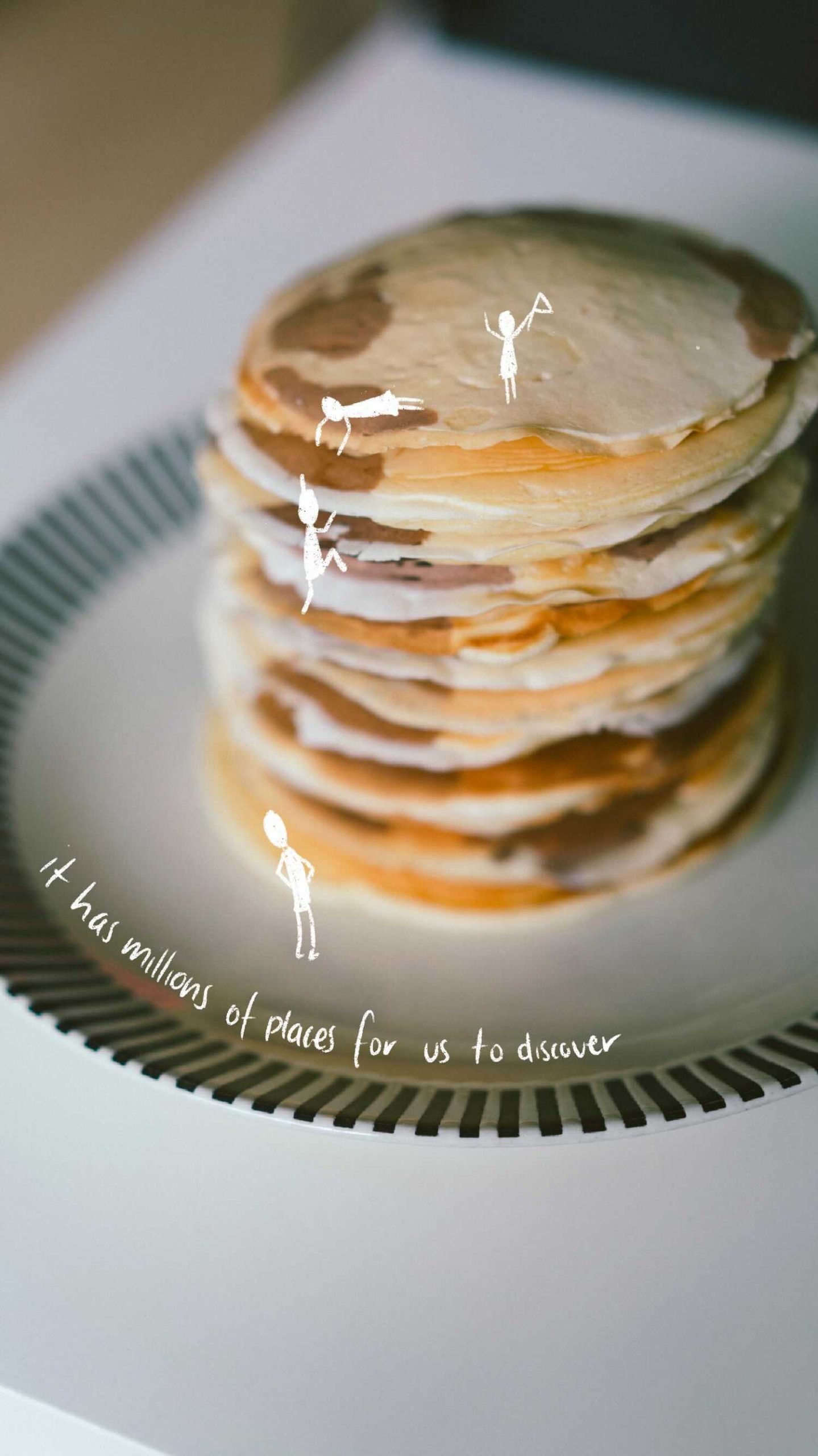Stack of pancakes with doodles of people climbing down them quote- it has millions of places for us to discover