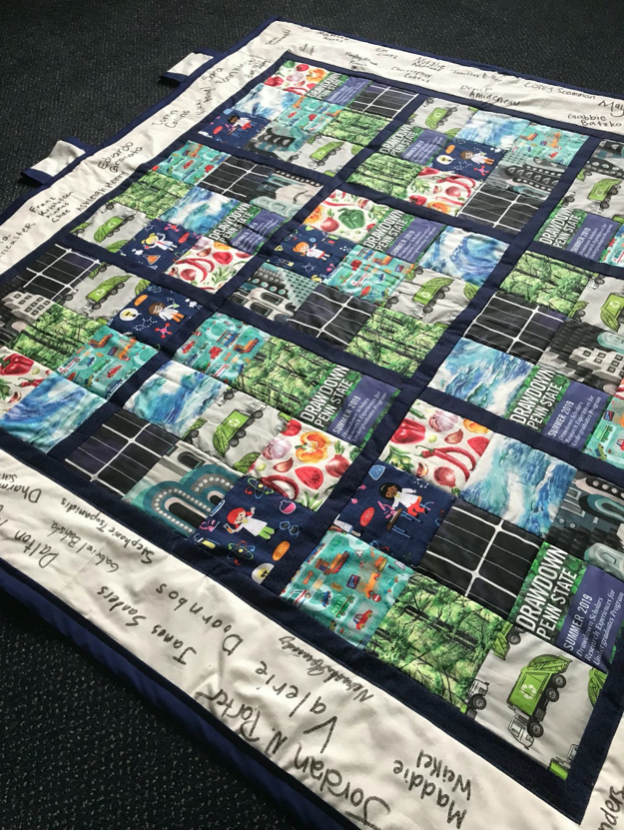 Quilt in a Sudoku pattern representing solutions to climate change from Project Drawdown.